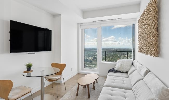 a living room with a tv and couches