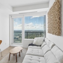 a living room with a tv and couches