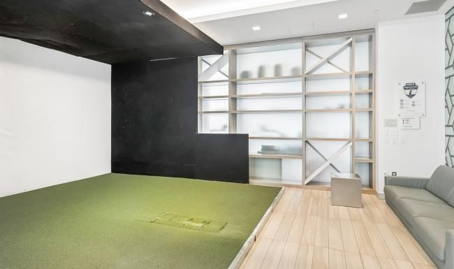 a room with a glass door and a couch
