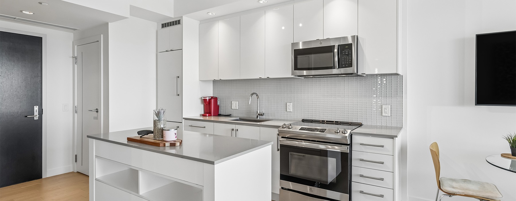 a kitchen with white cabinets