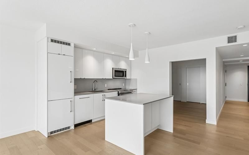 a kitchen with white cabinets