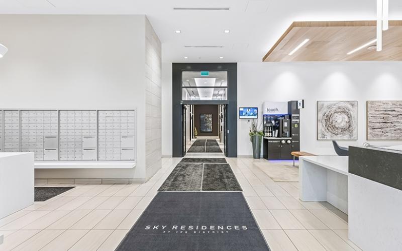 a room with white walls and a black tiled floor