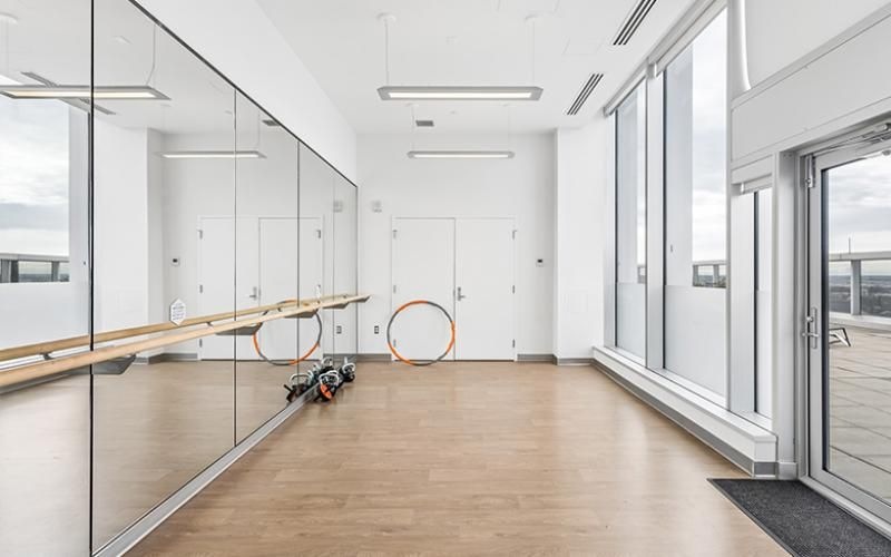 a room with white walls and a wood floor